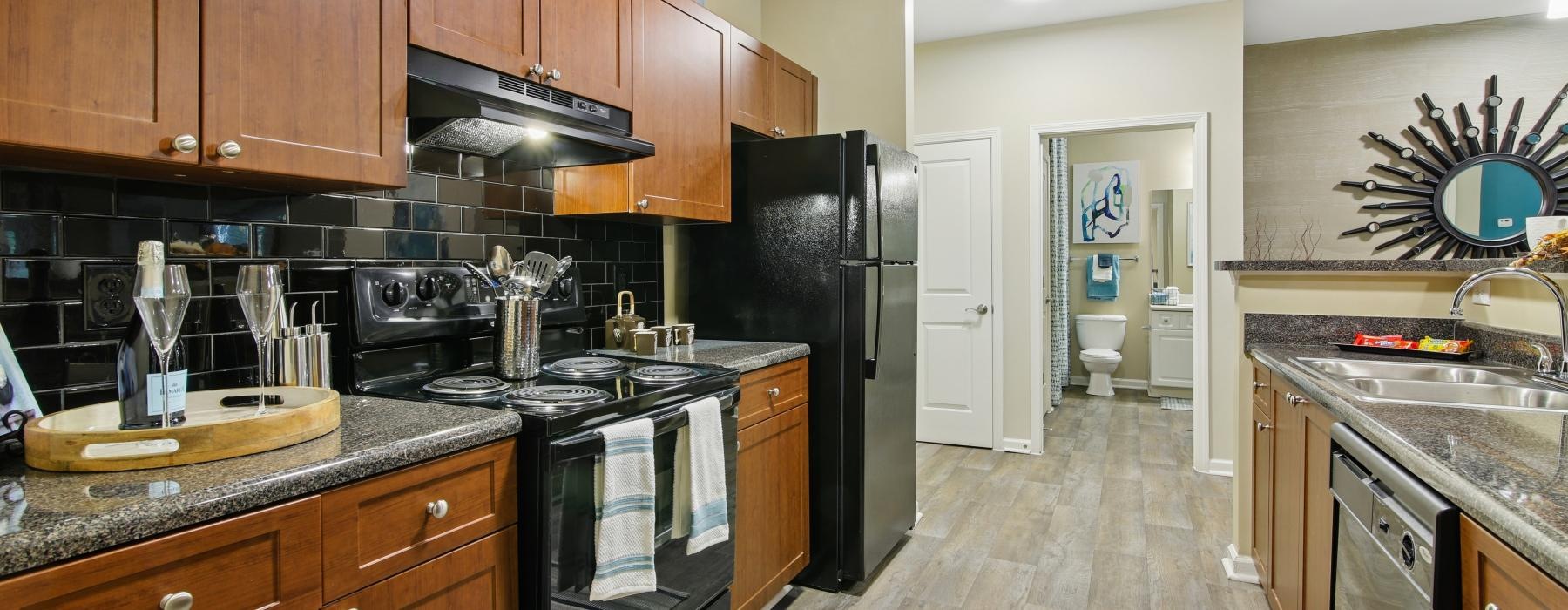 a kitchen with wooden cabinets