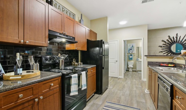 a kitchen with wooden cabinets