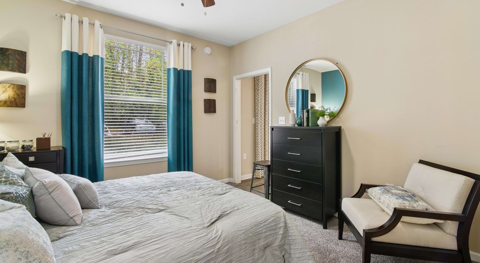 a bedroom with a bed and a chair