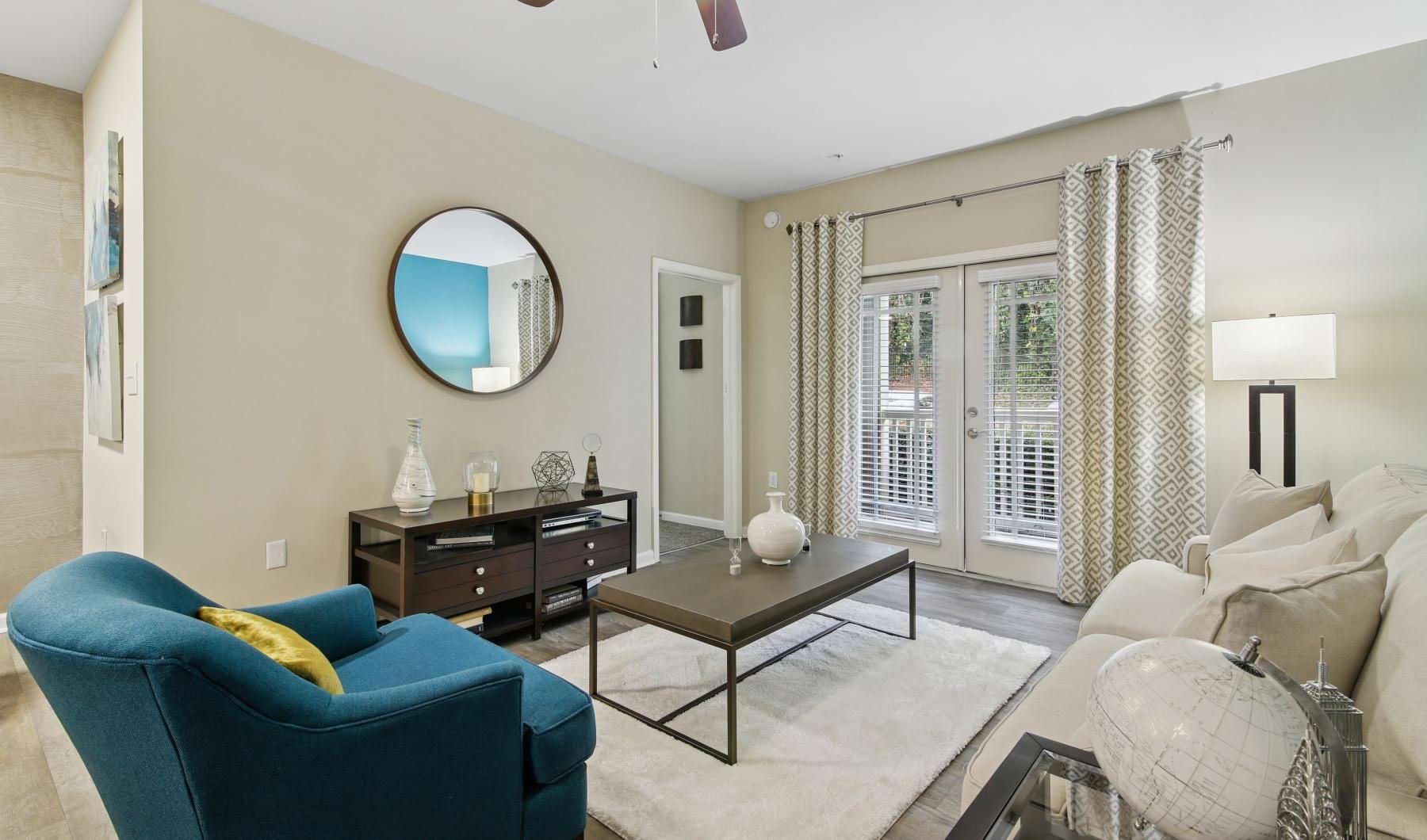 a living room with a blue chair