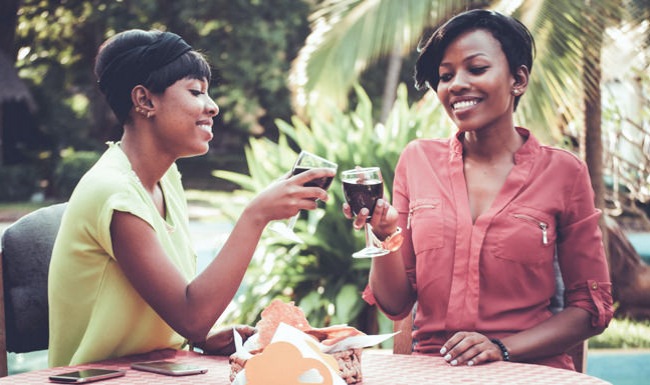 Ladies toasting with wine glasses